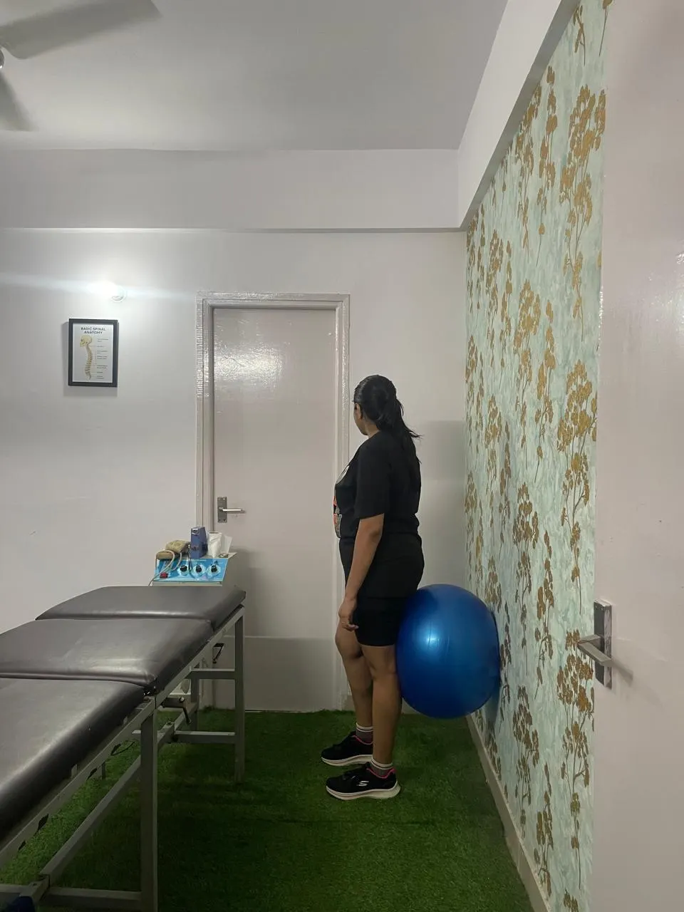 Exercise therapy area with treatment tables and gym ball